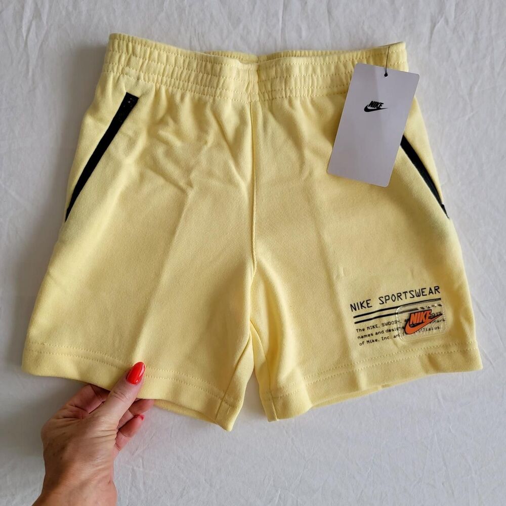 NWT NIKE boy's terry sweatshorts in pastel yellow.